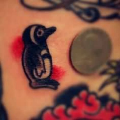 Nice Black Ink Penguin Tattoo