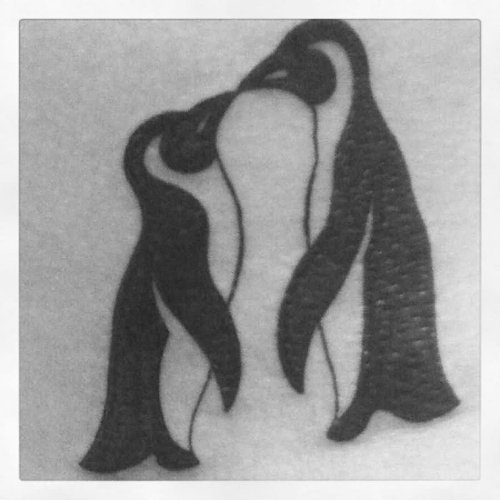 Black Ink Kissing Penguin Tattoo