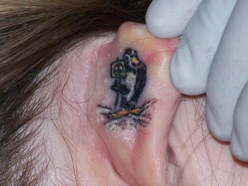 Penguin Tattoo Behind Ear
