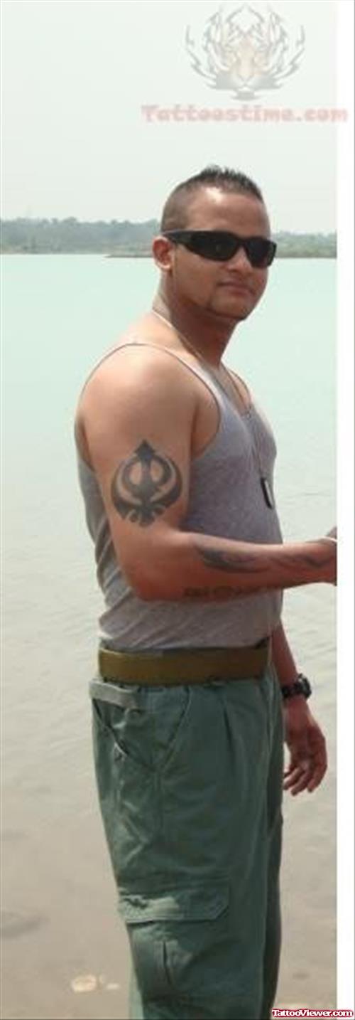 Punjabi Khanda Tattoo On Muscles