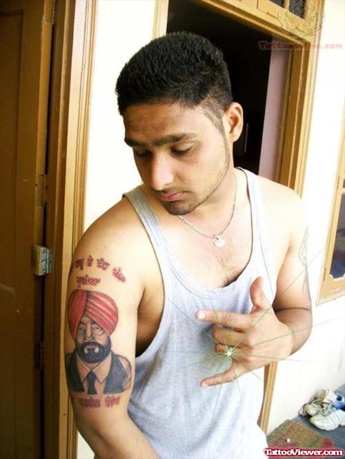 Punjabi Man Tattoo On Biceps