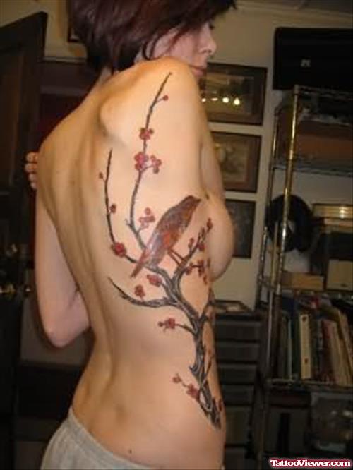 Bird And Tree Tattoo On Rib
