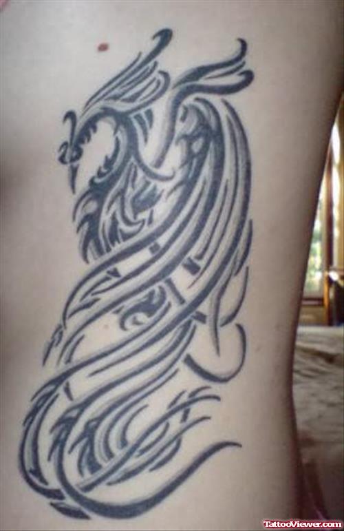 Grey Phoenix Tattoo On Rib