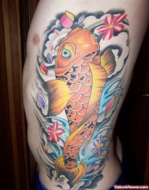 Golden Fish Tattoo On Rib