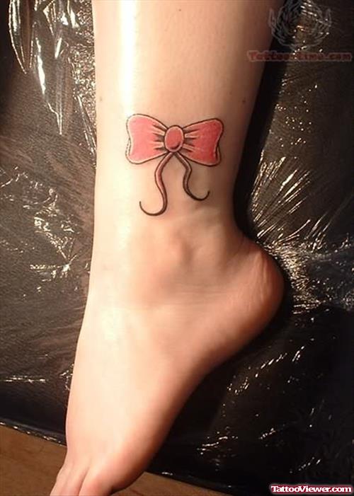 Pink Bow Tattoo on Her Ankle