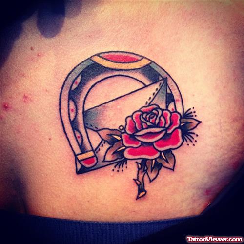 rose in horseshoe tattoo
