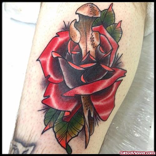 rose pierced by dagger tattoo