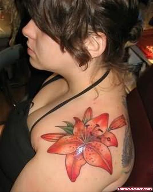 Lily Tattoo On Upper Shoulder