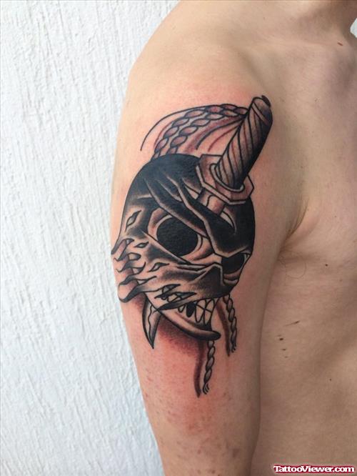 skull with dagger tattoo