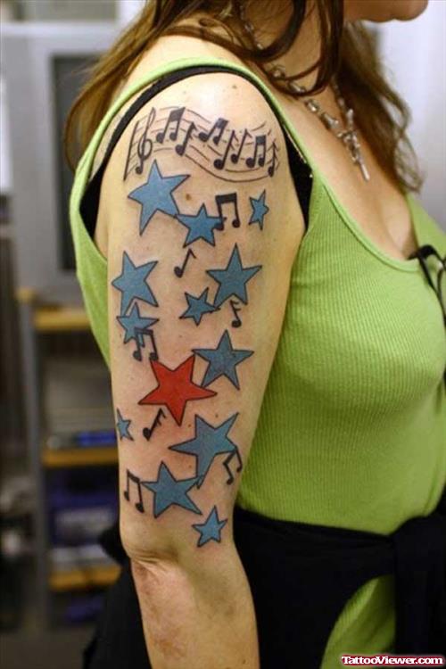 Music Notes Blue Stars And Red Star Half Sleeve Tattoo