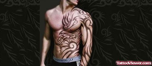 Tribal Sleeve And Chest Tattoo