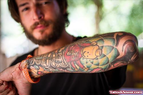 Man Left Sleeve Colored Tattoo