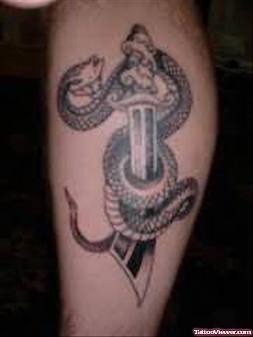 Snake And Sword Tattoo On Elbow
