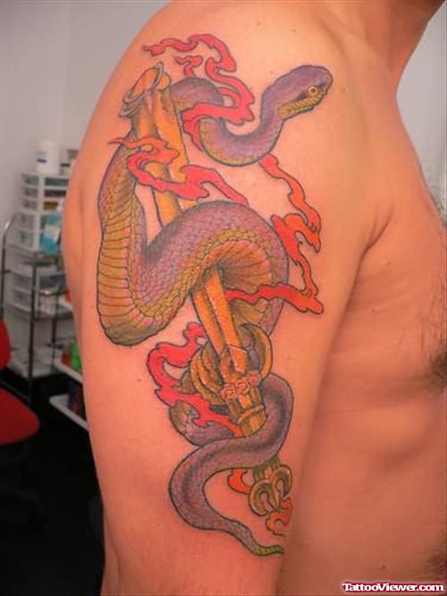 Sword And Snake Tattoo On Shoulder