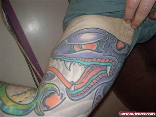 Deadly Snake Tattoo On Muscles
