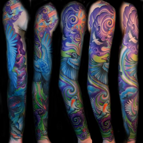 Colored Flying Bird And Sleeve Tattoos