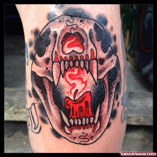Candle in jaws snake tattoo
