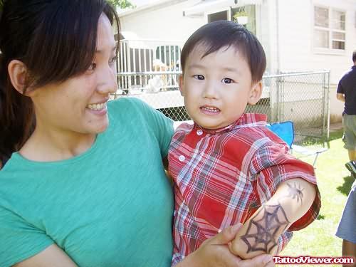 Spider Web Tattoo On Child Arm
