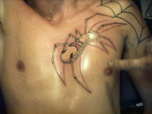 Spider Face Tattoo On Chest