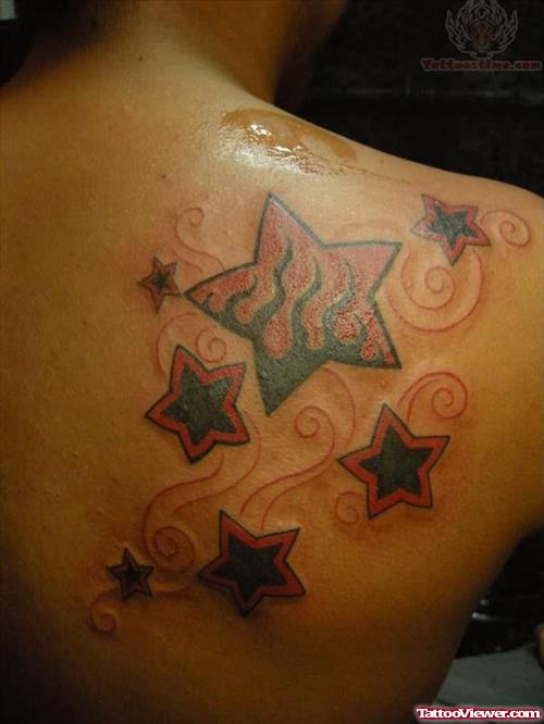 Burning Star Tattoo On Back Shoulder