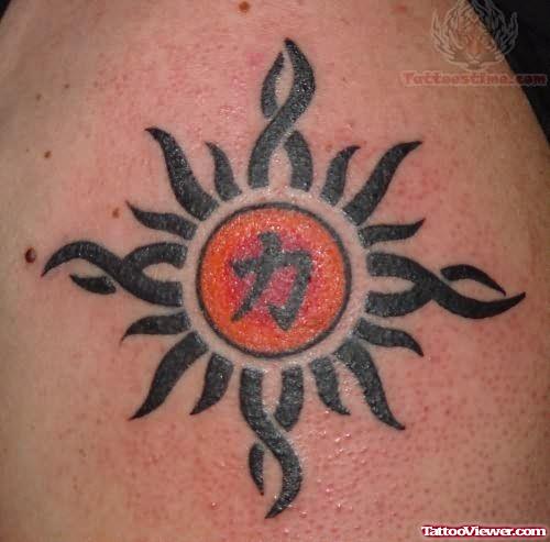 Tribal Sun Tattoo on Biceps