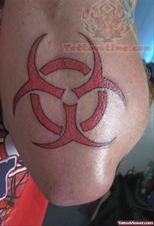 A Symbol Tattoo On Elbow