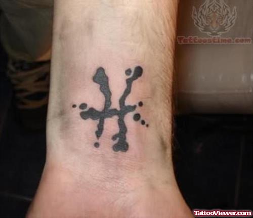Pisces Symbol Tattoo On Wrist