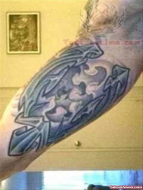 Blue Symbol Tattoo On Arm