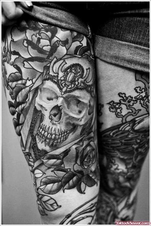 Grey skull and Flowers Thigh Tattoo