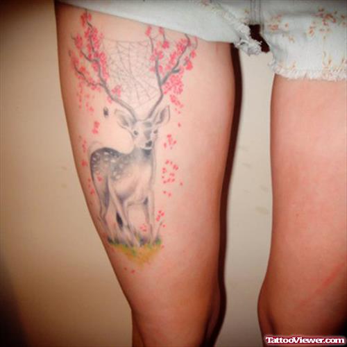 Flowers, spider Web And Deer Thigh Tattoo
