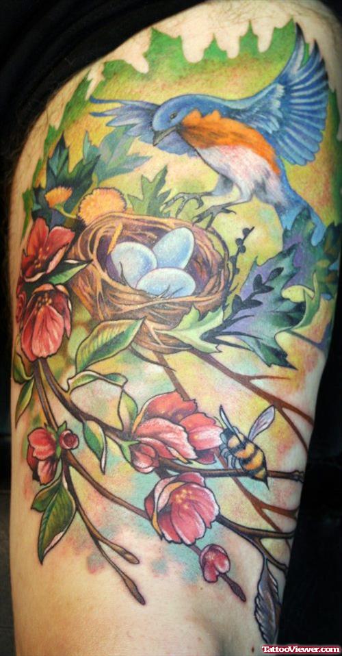 Blue Hummingbird And Nest Tattoo On Thigh