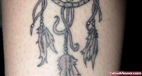 Grey Ink Dreamcatcher Feather Tattoo On Thigh