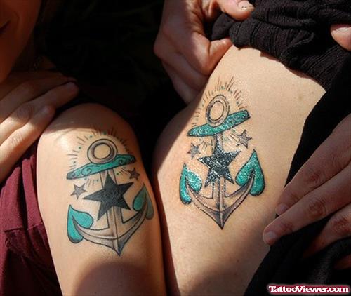 Colored Anchor Tattoos On Couple Thigh