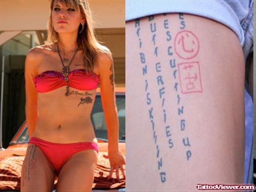 Girl With Script Tattoo On Right Thigh