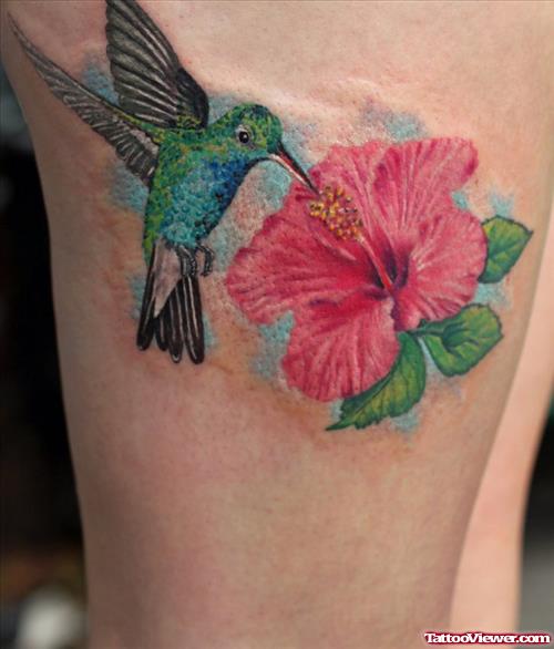 Colored Humming Bird And Lily Flower Tattoo On Thigh
