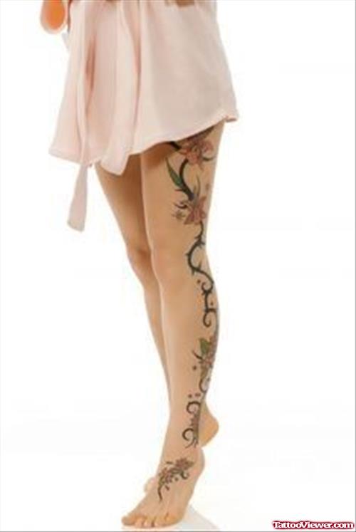 Amazing Tribal And Flowers Thigh Tattoo For Girls