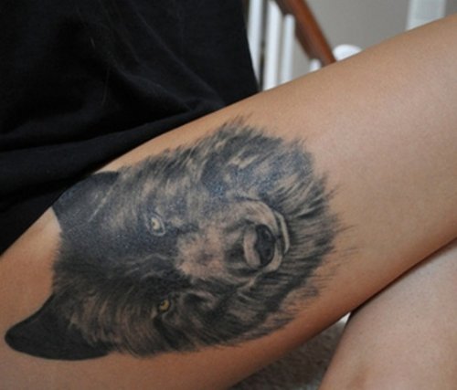 Black Ink Wolf Head Thigh Tattoo