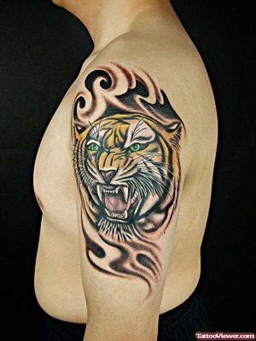 Tribal And Tiger Tattoo On Left Shoulder