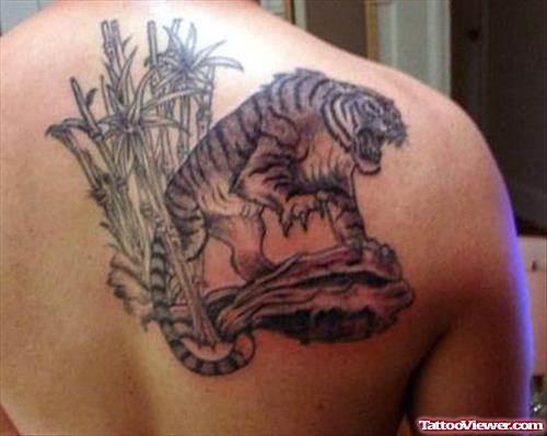 Grey Ink Bamboo Trees And Tiger Tattoo On Back