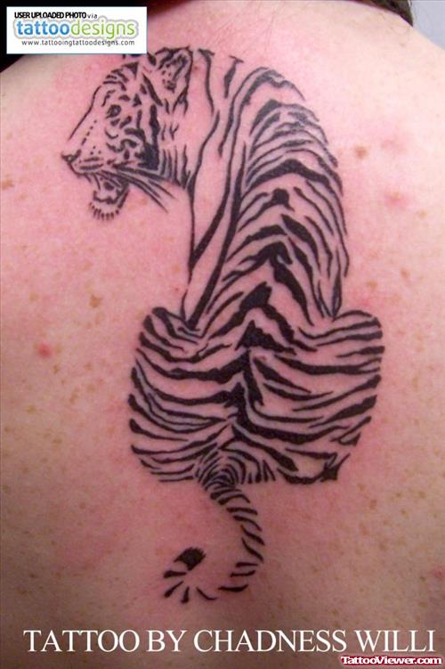 Black Ink Tribal Tiger Tattoo On Back Body