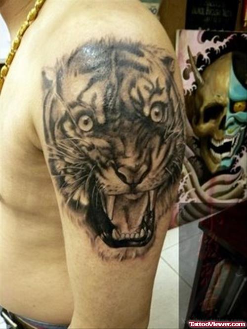 Awesome Grey Ink Roaring Tiger Head Tattoo On Left Shoulder