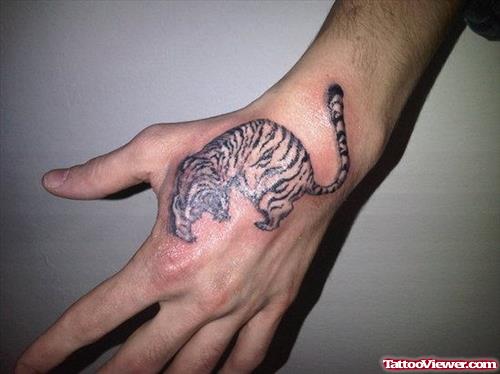 Grey Ink Tiger Tattoo On Left Hand