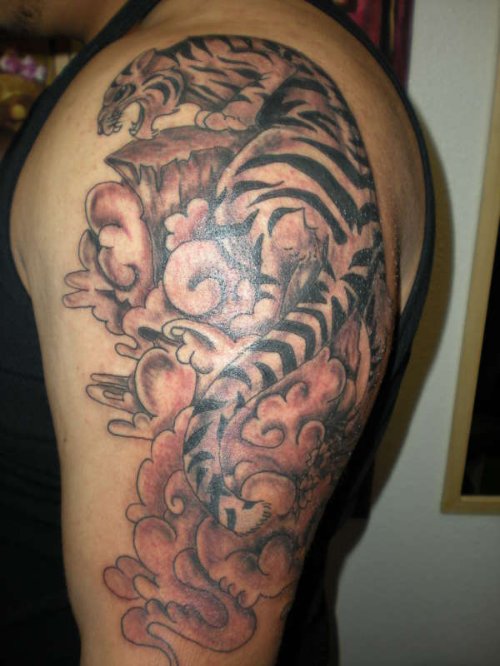 Grey Ink Tiger Tattoo On Man Left Sleeve