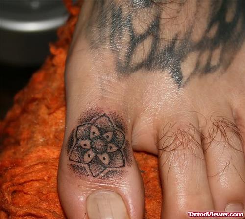 Star Flower Tattoo Design On Toe