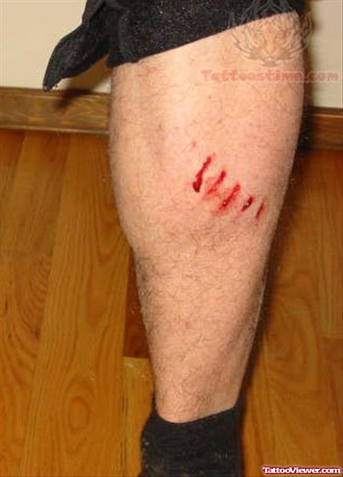 Torn Ripped Skin Tattoo On Man Leg