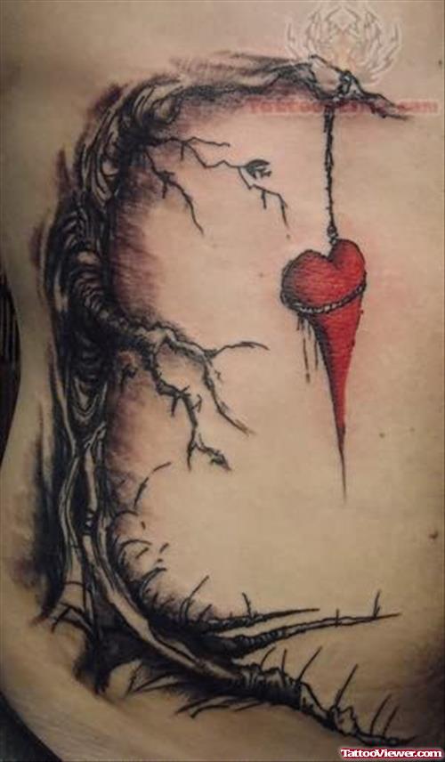 Heart Hanging On Tree Tattoo