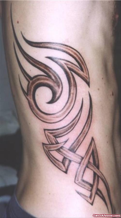 Grey Ink Tribal Tattoo On Side Rib