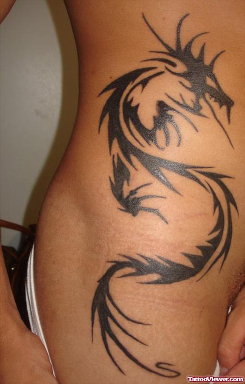 Black Ink Tribal Dragon Tattoo On Side Rib