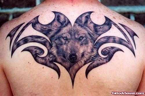 Wolf Head And Tribal Tattoo On Upperback