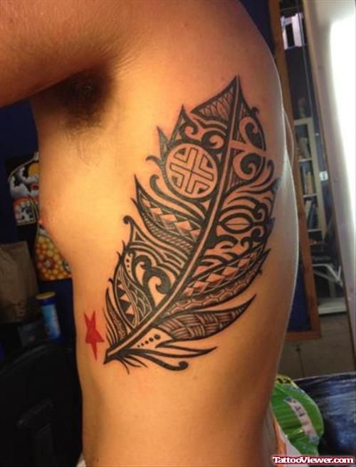 Tribal Leaf Tattoo On Man Left Side Rib